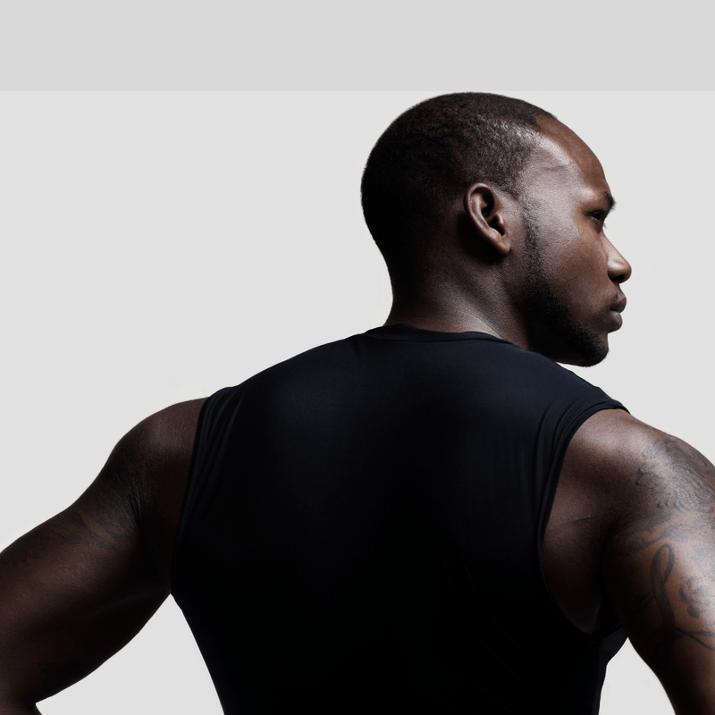 Male standing with his back to photo