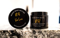 Vee Love whipped body butter in a Neeno Body black jar on a marble countertop
