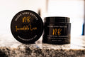 Incredible Love whipped cream body butter in a Neeno Body black jar on a marble countertop