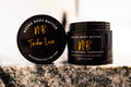 Timber Love whipped body butter in a Neeno Body black jar on a marble countertop