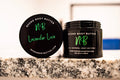 Lavender Love whipped body butter in a Neeno Body black jar on a marble countertop
