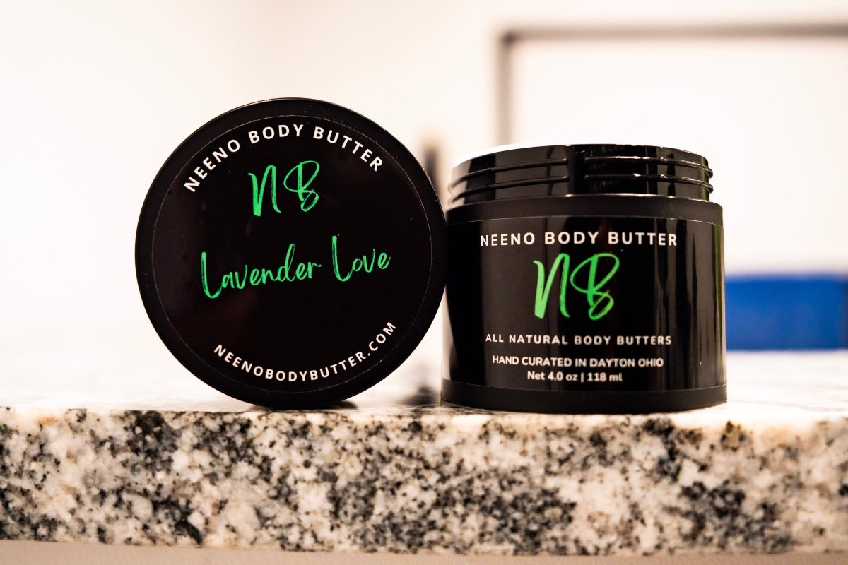 Lavender Love whipped body butter in a Neeno Body black jar on a marble countertop