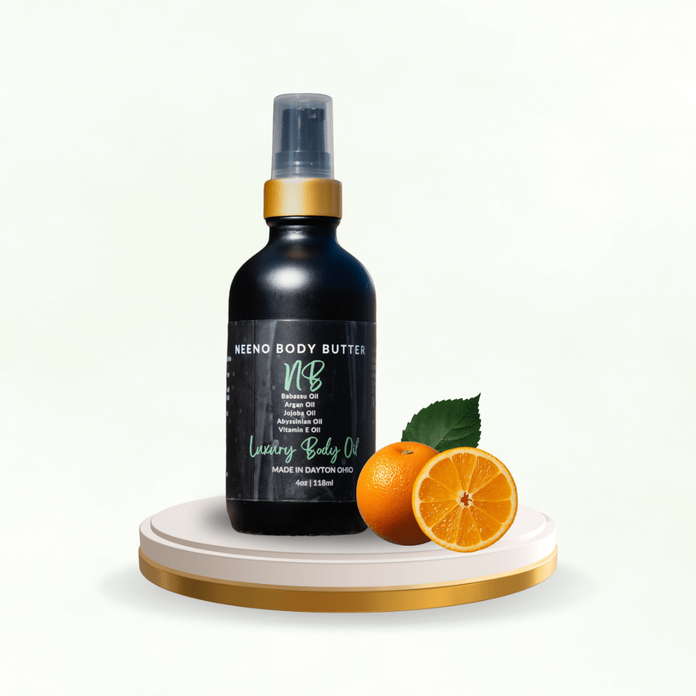 Neeno Body Butter black matte bottle sitting next to an orange on a pedesal