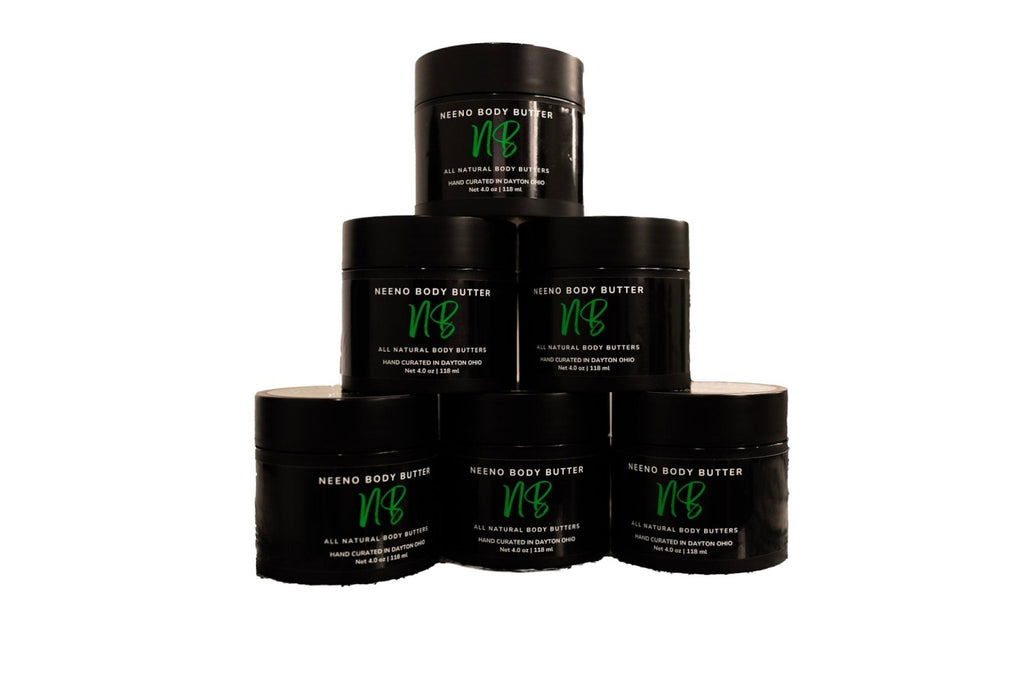six jars of black mini Neeno Body Butter jars stacked