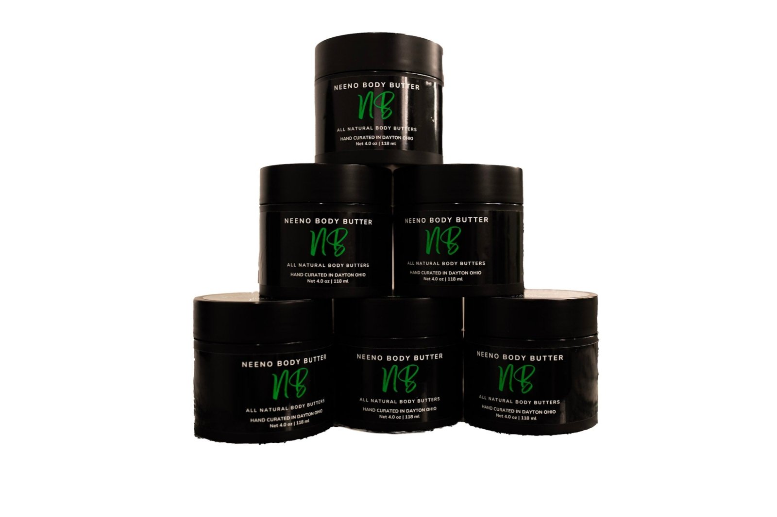 six jars of black mini Neeno Body Butter jars stacked