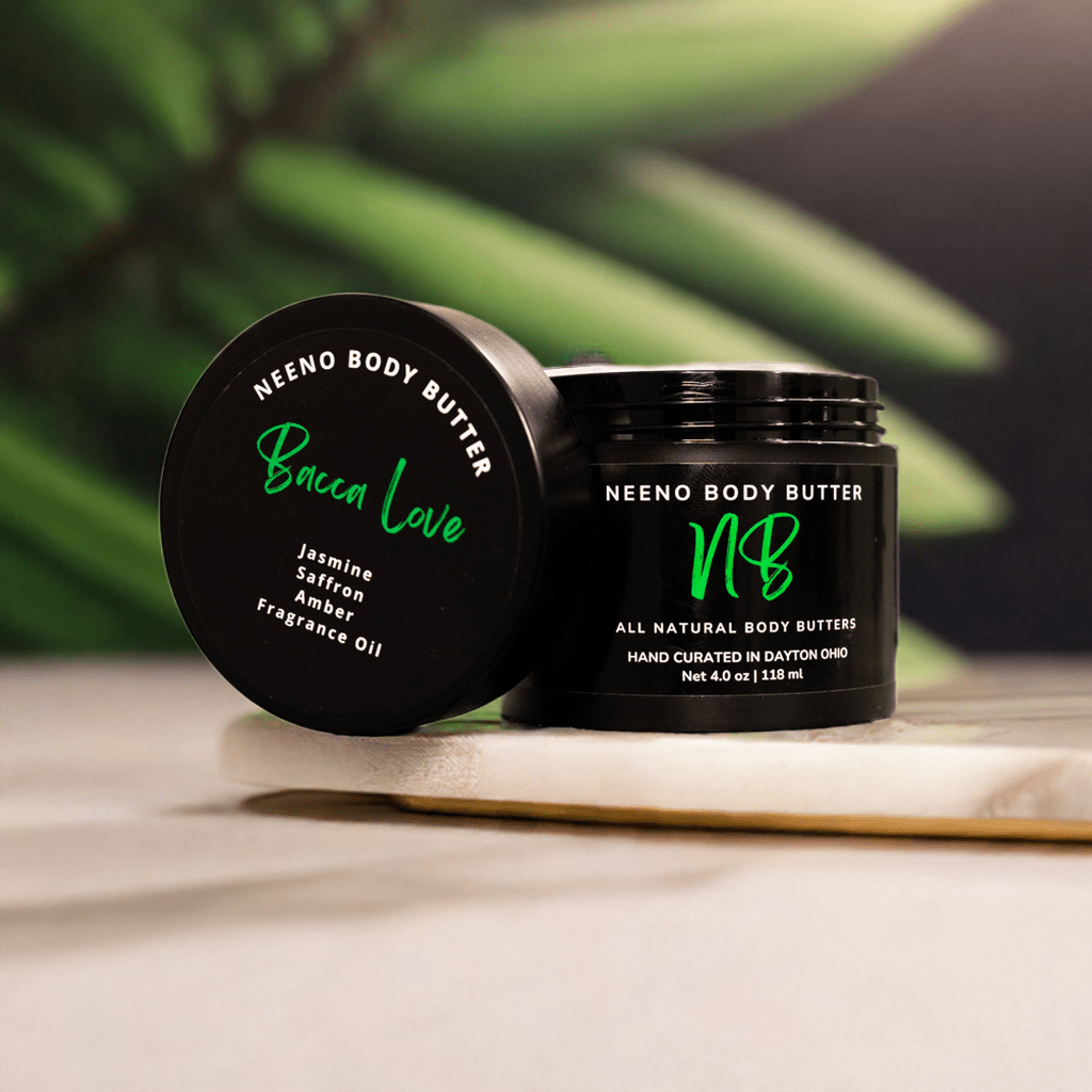 "Bacca LOVE" body butter by Neeno,  in an elegant black jar with a matching black lid. The product name is prominently displayed in a stylish, white, cursive font on the lid, alongside the tagline "All Natural Body Butter" 