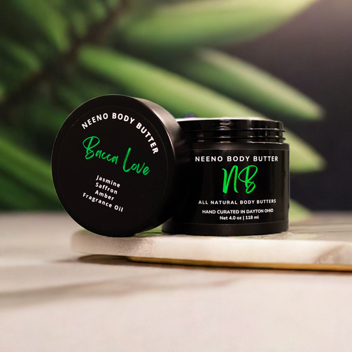 "Bacca LOVE" body butter by Neeno,  in an elegant black jar with a matching black lid. The product name is prominently displayed in a stylish, white, cursive font on the lid, alongside the tagline "All Natural Body Butter" 
