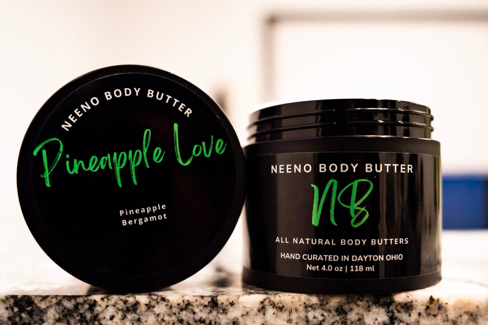 Jar and lid of Pineapple Neeno Body Butter